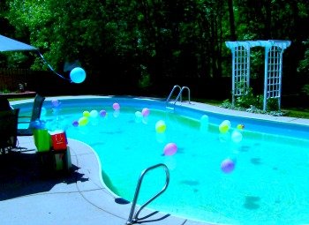 image of balloons floating in a swimming pool