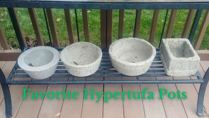 4 hypertufa pots on shelf
